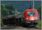 Ein Ganzzug mit Neuwagen, bespannt von 1116 031 am 11.6.2006 kurz nach Schl�glm�hl.