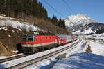 1144 029 auf dem Weg nach Wörgl am 15. Februar 2023 bei Pfaffenschwend.