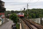 S7-Zug 29438 (Wolfsthal - Floridsdorf) mit dem 4746 021-6 als letztes Fahrzeug hat am 22.Juni 2024 soeben die Haltestelle  Hainburg an der Donau Personenbahnhof  in Richtung  Hainburg an der Donau