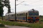 Anlässlich  110 Jahre Preßburgerbahn  wurden am 01., 08., 15. und 22.Juni 2024 zwischen Schwechat und Wolfsthal Sonderzüge mit der TMW-Garnitur 4030.210 + 7030.210 + 6030.203 in Verkehr gesetzt. - Das Bild vom 22.Juni 2024 zeigt die Garnitur beim Strecken-Km 33,7 der Preßburgerbahn am 22.Juni 2024.