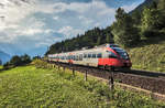 4024 111-9 fährt als R 4939 (Mallnitz-Obervellach - Spittal-Millstättersee) nahe Penk vorüber.
Aufgenommen am 10.7.2017.