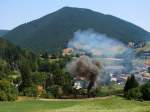 Der Dampfzug mit 999.05  Puchberg  verlsst den Bahnhof Puchberg am Schneeberg  04.08.2013.