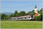 Nachschuss auf den R 8553 (5063 011 und 5063 009)von Graz ber Lieboch nach Wies-Eibiswald am 16.6.2011 mit der Kirche der Marktgemeinde Wies im Hintergrund.