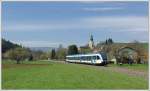 5063 008 am 17.4.2012 als S6 (R 4370) von Wies ber Hengsberg nach Graz bei der Ausfahrt aus der Haltestelle Wies-Markt mit Blick auf die dortige Pfarrkirche.