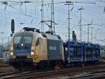 ES 64 U2 -035 der Wiener Lokalbahnen mit Khne und Nagel Werbung zieht am 15.02.2011 einen leeren Autotransportzug aus Aachen West Richtung Kln.