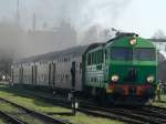 SU46-033 mit einem Regionalzug am 30.4.2005 in Wolsztyn.
