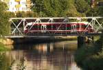 Der noch sehr neue SA 103-008 berquert am 28.08.2006 als Zug 822 aus Goleniow kommend die Persante-Brcke in Kolobrzeg (Kolberg) und wird in wenigen Augenblicken den Bahnhof der Kurstadt erreicht haben 