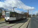 Tram 684 unterwegs auf der Linie 7 in Szczecin (Stettin) am Zwyciestwa(=Hohenzollern)-Platz mit der St.Adalbert-Kirche im Hintergrund.