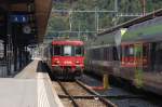 Die Re 465 012-6 der BLS wird mit ihrer Garnitur als EXT31276 ber die alte Ltschbergstrecke fahren, hier ist sie aber noch im Bahnhof von Brig (1.