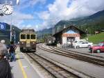 Bahnhof Grindelwald im Juli 2003. Im Bild ein Zug der Berner Oberland Bahn (BOB). Hier besteht eine Umsteigemglichkeit zur Wengernalpbahn (WAB), mit der man zur Kleinen Scheidegg fahren kann.