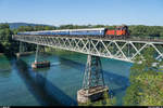 Wiedereröffnung der Strecke Etzwilen - Singen am 16. August 2020.<br>
Em 3/3 18814 der Stiftung Museumsbahn SEHR & RS mit dem Eröffnungszug auf der Rheinbrücke Hemishofen.