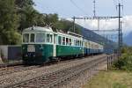 100 Jahre BLS: Der bunte Pendelzug mit dem ex BN RBDe 565 bei Ausserberg am 7. September 2013.
Foto: Walter Ruetsch