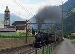 SBB HISTORIC: 
 Schweiz aktuell am Gotthard  - Dampfzug 30052 mit der C 5/6 2978 und nostalgischen Wagen auf der Rückfahrt beim Passieren der prächtigen Kirche San Michele von Giornico aus dem 12. Jahrhundert am 28. Juli 2016. 
Foto: Walter Ruetsch