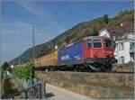 Auf dem letzten Einspurabschnitt der Jurafuss Strecke ist bei Ligerz ist die SBB Re 4/4 II 11288 (Re 420 288-3)  Avanti tutta  mit einem Postzug auf dem Weg nach Biel/Bienne. Und obwohl die Lok das Bild dominiert, ist doch die bekannte Kirche von Ligerz zu sehen, bzw. deren Kirchturm

16. Juli 2026