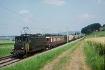 SBB/BLS: Anfangs der 90er-Jahre wurde bei Schönbühl verewigt:  Alltäglicher Güterzug auf der Fahrt Bern-Biel RB mit einer Doppeltraktion SBB/BLS, bestehend aus einer Ae 4/7 und
