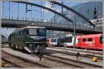 Extrazug mit SBB-Historic Lok Ae 6/6 11407  Aarau  vor dem ausfahrenden Glacie Express 903 in Chur. (06.06.2015)