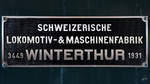 Eines des Fabrikschilder auf der 1931 gebauten Elektrolokomotive Ae 4/7  10 949 .