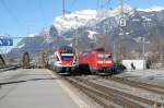 RE nach Chur bei der Einfahrt in Landquart,rechts die DB Lok 185 123-7 auf  dem Lokgleis.26.02.15