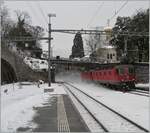 Eine  Re 10/10  wirbelt bei der Durchfahrt in Vevey allerlei Schnee auf.
19. Jan. 2016