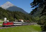 The Re 4/4.11164 of SBB hauls a the IR 2173 Basell SBB - Locarno, here in Intschi.