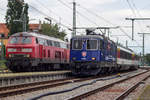 218 413-0 und 421 383-1 mit den Eurocitys 195/194 in Lindau Hbf.