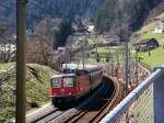 Re 4/4 II mit FS-Wagen nach Basel SBB am 26.03.2008 bei Intschi