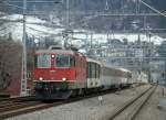 Kurz darauf folgt die Re 4/4 II 11144 mit dem bunten RE 3838  Rheintal-Express  nach St. Gallen. 
2. Mrz 2009