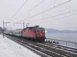 Re 4/4 11192 mit einem Voralpenexpress am 22.2.05 auf dem Streckenabschnitt Immensee - Arth-Goldau.