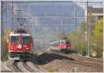 RE1252 mit Ge 4/4 II 618  Bergn/Bravuogn  und RE3825 mit Re 4/4 II 11217 erreichen gemeinsam Chur Wiesental. (19.04.2010)