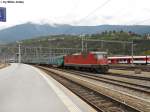 Die Re 4/4'' 11199 schiebt am 18.9.2010 ein Regio nach Domodossola aus dem Bhf. Brig. Da am Simplon auch die Regionalzge begleitet werden mssen, kann man auf diesen Zgen, Rollmaterial einsetzen, dass nicht fr KlB-Betrieb ausgerstet ist.