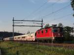 Re 4/4 II 11208 mit Talgo nach Genf/Barcelona bei Langenthal am 23.05.2011