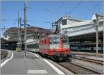 Die  Swiss Express  Re 4/4 II 11109 mit dem IR 1427 von Genve Aroport nach Brig bei der Abfahrt in Lausanne am 1. August 2011.
