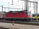 SBB - Re 4/4  11265 abgestellt im Bahnhofsareal von Cornaux am 11.03.2012