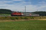 Re 4/4 II 11140 zieht am 06.07.2014 den IC 183 von Schaffhausen Richtung Zürich HB, aufgenommen bei Rafz.
