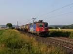 Die Re 421 389 mit einem Kesselzug am 06.07.2013 unterwegs bei Himmelstadt.