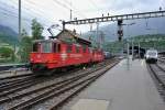 Re 436 115-0 und Re 436 112-7 bei Ausfahrt in Brig, 29.06.2014.