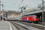 Die SBB Re 460 058-1  100 Jahre Zirkus Knie  wartet mit ihrem IC1 713 in Lausanne auf die Abfahrt.

21. April 2019