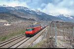 SBB Re 460 114-2 und Re 460 084-7 sind mit ihrer IC2000 Komposition unterwegs als IR 30822 von Brig nach Genf Flughafen und konnten hier bei Sierre/Siders aufgenommen werden.