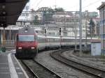 SBB - 460 098-7 mit RE bei der einfahrt im Bahnhof Lausanne am 11.01.2014