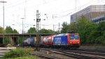 482 003-1 von SBB-Cargo kommt aus Richtung Köln,Aachen-Hbf mit einem langen Containerzug aus Gallarate(I) nach Antwerpen-Oorderen(B) und fährt in Aachen-West ein am Abend des 15.5.2013.