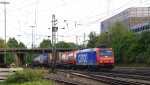 482 003-1 von SBB-Cargo kommt aus Richtung Kln,Aachen-Hbf mit einem langen Containerzug aus Gallarate(I) nach Antwerpen-Oorderen(B) und fhrt in Aachen-West ein am Abend des 15.5.2013.