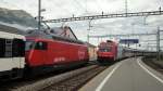 Die Re 484 019-5 trifft am 19.07.11 mit dem EC 15 in Arth-Goldau ein und begegnet der wartenden Re 460 000-3  Grauholz .