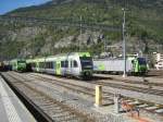 BLS treffen in Brig: von links nach rechts; Nina Nr. 24, Ltschberger Nr. 106 und Re 485 019 (und 485 002, verdeckt) mit Gterzug, 12.10.2011.