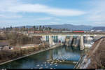 Re 6/6 11616 mit einem Güterzug Birsfelden Hafen - RBL am 28. Februar 2018 auf der Brücke beim Kraftwerk Wettingen.