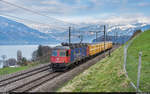 SBB Cargo Re 6/6 11607 mit Postzug Brig - Härkingen am 3. April 2021 bei Einigen. Der samstags verkehrende Zug ist normalerweise mit einer Re 4/4 II bespannt.