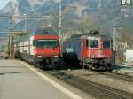 IR Basel-Chur am 25.02.08 bei der Einfahrt in Landquart.Rechts auf dem Lokgleis,die abgebgelte Cargolok Re 6/6 620 055-4