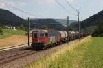 Re 620 058 mit einem Kesselwagenzug am 28.06.2011 bei Tecknau.