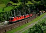 Eine Re 6/6 und zwei Re 4/4 machen sich am 28.08.2012 mit einem Gterzug bei Wassen auf dem Weg nach Erstfeld.