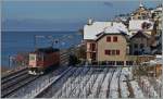 Auch im Lavaux kann es schneien, dann aber ist mit dem Fotografieren Eile geboten, denn lange liegt der Schnee hier nicht. 
Re 6/6 bei St-Saphorin am 30. Dez. 2014