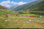Am 24.07.2022 ist MGB HGe 4/4 104 unterwegs mit einem GEX in Richtung Zermatt und konnte hier bei Hospental, Zumdorf aufgenommen werden